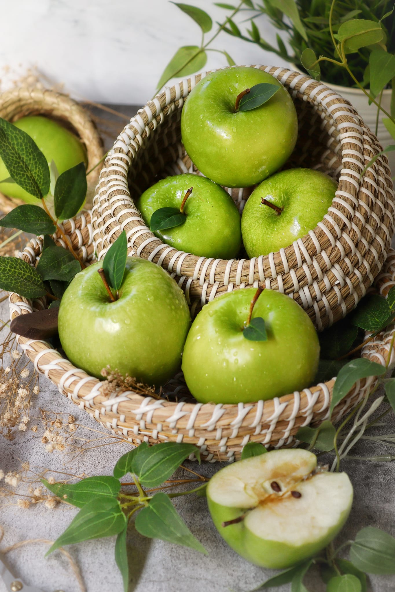 Green apples inside a basket